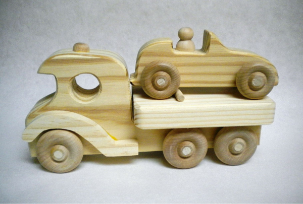 Flat bed with car.