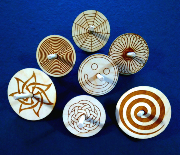 Laser engraved spin Tops.